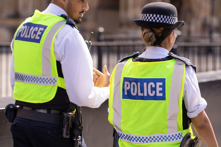 Two police officers in the street